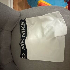 White Nike shorts
